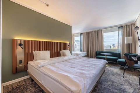 Family room | Hypo-allergenic bedding, down comforters, in-room safe, desk