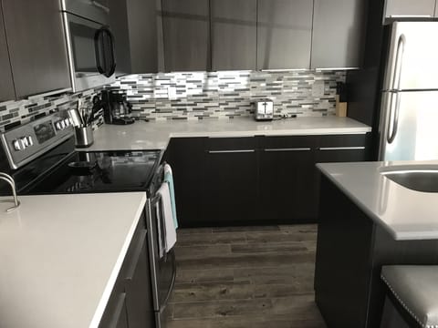 New countertops in kitchen as well as brand new oven/range and microwave.