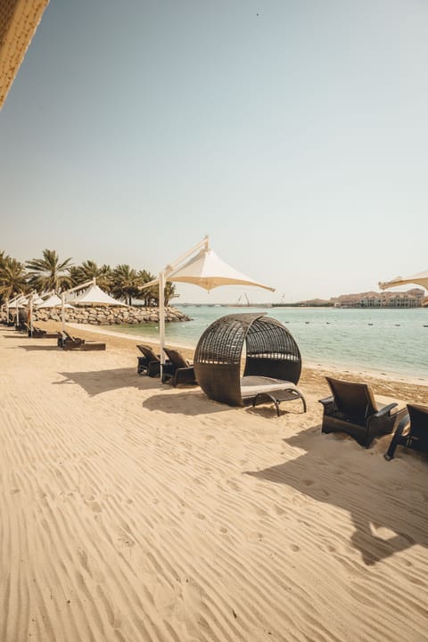 Private beach, beach umbrellas, beach towels