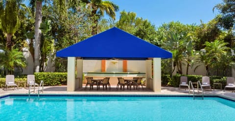 Outdoor pool, open 7:00 AM to 11:00 PM, pool umbrellas, sun loungers