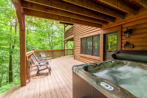 Looking over Hot Tub at Open Air portion of Lower Deck with More Deck Furniture