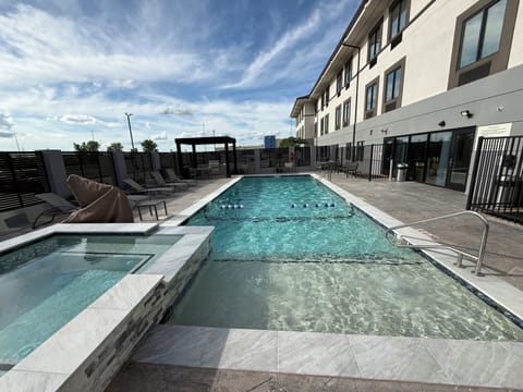 Seasonal outdoor pool, open 9:30 AM to 10:00 PM, pool umbrellas