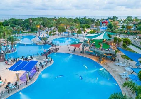 2 indoor pools, 5 outdoor pools, open 7:30 AM to 7 PM, pool umbrellas