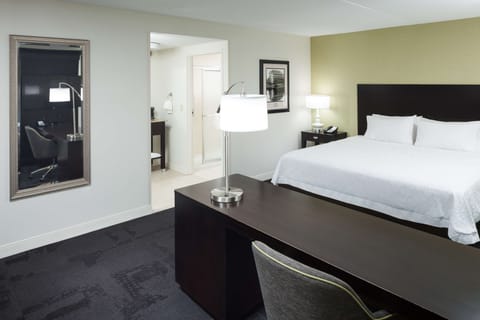 Premium bedding, desk, laptop workspace, blackout drapes