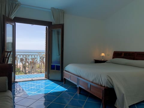 Superior Double Room, Partial Sea View | Minibar, in-room safe, desk, free WiFi