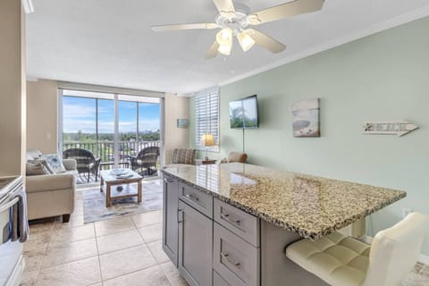 Enjoy the remodeled kitchen and open concept living area & screen enclosed balcony.