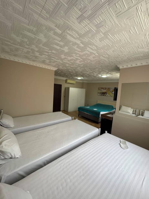 Family Quadruple Room, Garden View | 1 bedroom, minibar, in-room safe, desk