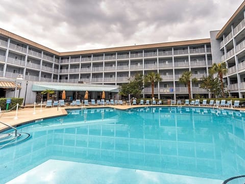 Indoor pool, seasonal outdoor pool, pool umbrellas, sun loungers