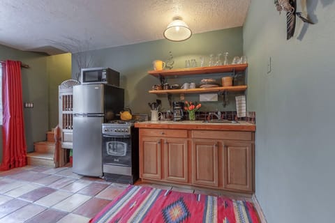 Deluxe Suite, 2 Bedrooms, Hot Tub, Garden View | Private kitchen | Shared fridge, microwave, coffee/tea maker