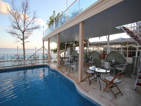 Outdoor pool, open 11:00 AM to 7:00 PM, sun loungers