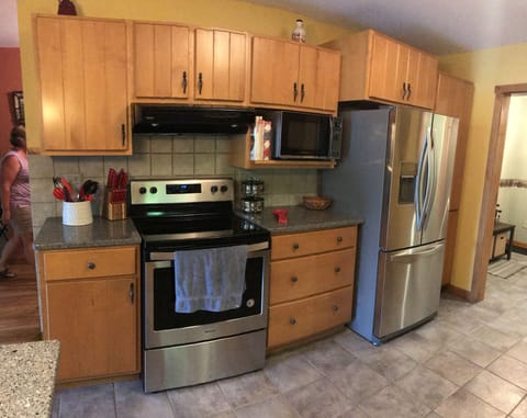 Galley Kitchen layout with custom cabinets and stainless appliance sets