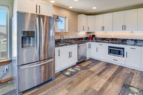 There is plenty of counter space in the kitchen for meal prep.