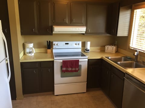 Well-stocked kitchen has everything needed for meal prep, spices & basic coffee.
