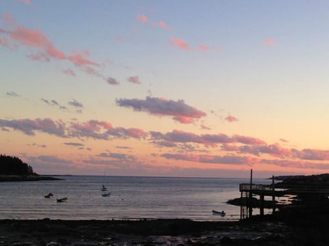 The setting sun on Lowell's Cove & the Atlantic ocean beyond.
