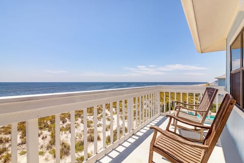 Master bedroom deck with views of the gulf and the pool.