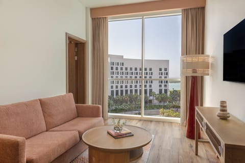 Deluxe Room Theme Park Access | Down comforters, in-room safe, desk, blackout drapes