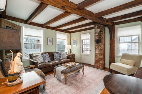 Living Room: Timber beams and natural light create a vibrant space for relaxation and fun!