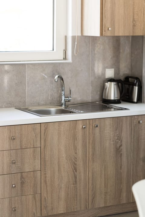 Junior Suite, Pool View | Private kitchen | Fridge, oven, stovetop, coffee/tea maker