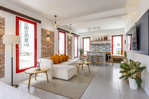 Family Suite | Living area | 55-inch flat-screen TV with satellite channels