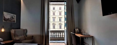 Deluxe Room, Balcony, City View | Desk, laptop workspace, soundproofing, iron/ironing board