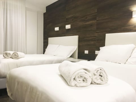 Quadruple Room | Premium bedding, minibar, in-room safe, blackout drapes