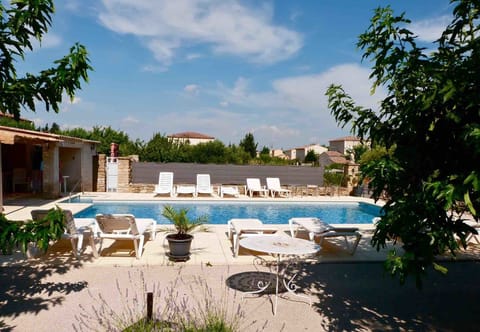 Seasonal outdoor pool, open 9 AM to 9:00 PM, pool umbrellas