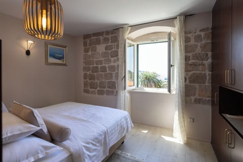 Suite, Sea View | Minibar, in-room safe, desk, iron/ironing board