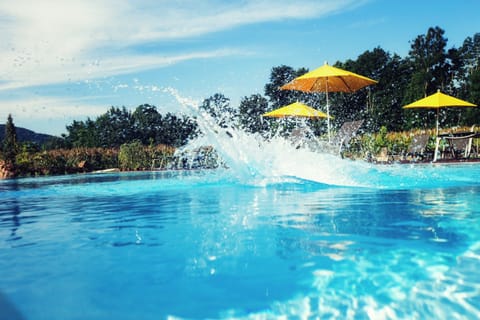 Seasonal outdoor pool, open 10 AM to 6 PM, pool umbrellas, sun loungers