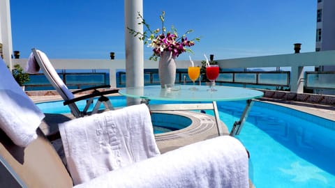 Outdoor pool, pool umbrellas, sun loungers