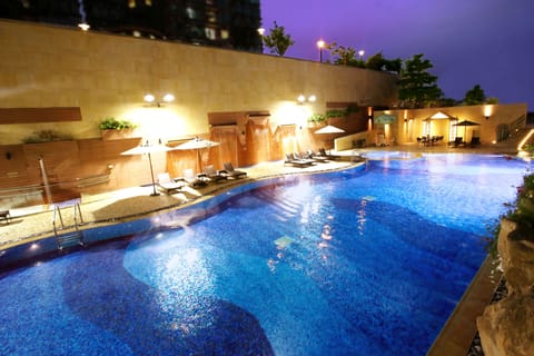 Seasonal outdoor pool, open 9:00 AM to 8:00 PM, pool umbrellas