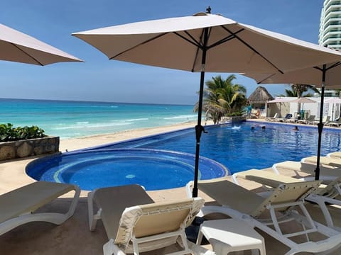 2 outdoor pools, open 9 AM to 9 PM, pool umbrellas, sun loungers