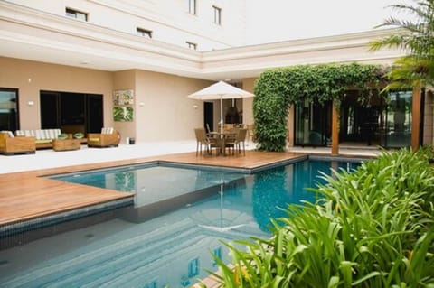 Outdoor pool, open 7:00 AM to 10:00 PM, sun loungers
