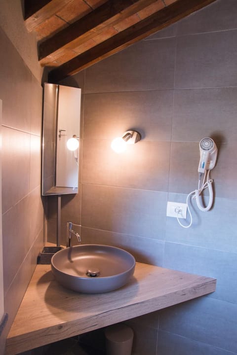 Shower, free toiletries, hair dryer, slippers