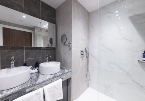 Separate tub and shower, eco-friendly toiletries, hair dryer, bathrobes