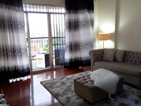 Apartment, 3 Bedrooms | Living room | Flat-screen TV