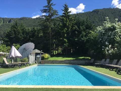 Seasonal outdoor pool, pool umbrellas, sun loungers
