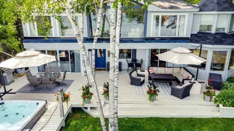 waterfront deck with hot tub plenty of seating