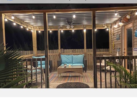 Backyard covered deck by game room