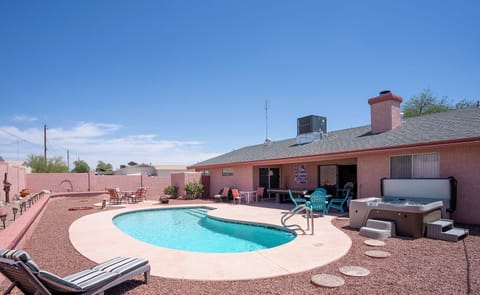 Pool, spa and pool table including chaises and tables ...from rear yard