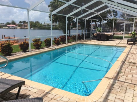 Screened-in pool area keeps you bug-free and comfortable. 