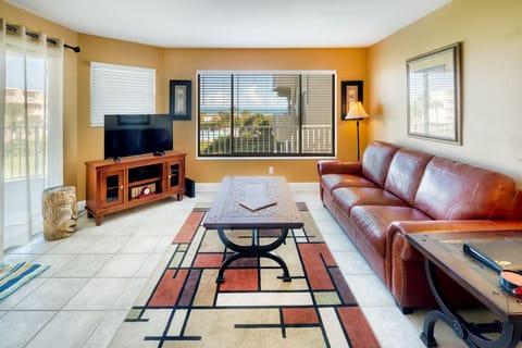 Living Room - Spacious living room with open floor plan and connected balcony featuring a direct view of the ocean.