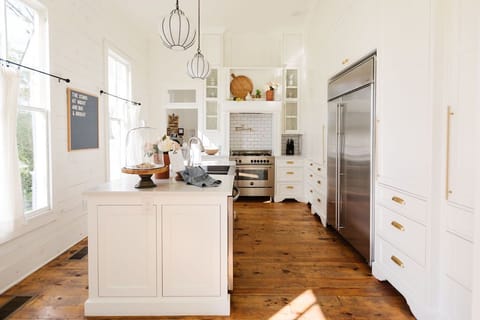 The kitchen is equipped with dishes, appliances and cookware for guests.