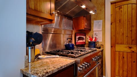 New gas stove (2024). Walk in pantry to the right.