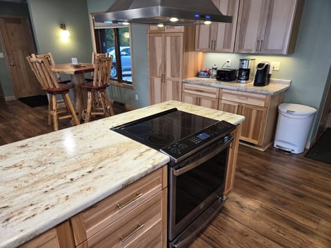 An electric flat top stove with a convection oven.