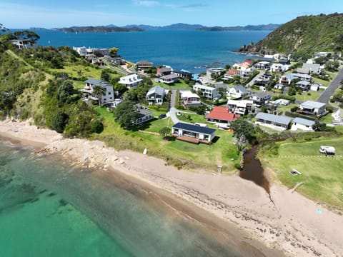 Absolute Beachfront with direct access to the all,tide swimming beach