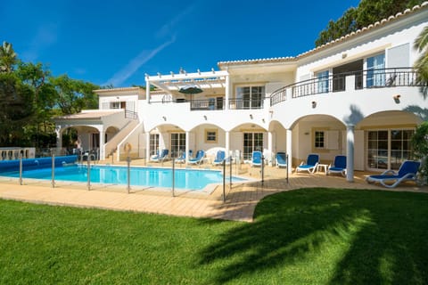 Pool area with fenced in heated pool