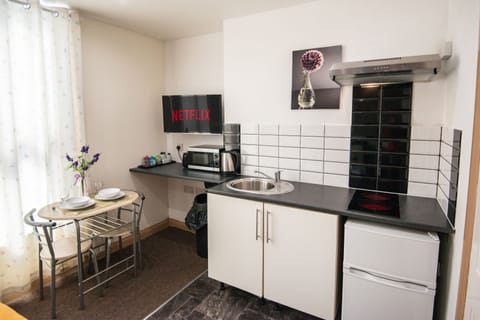 Studio, 1 Double Bed | Private kitchen | Full-size fridge, microwave, oven, electric kettle