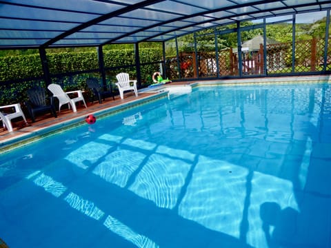 The  new telescopic enclosure lets you enjoy a swim/ relax whatever the weather