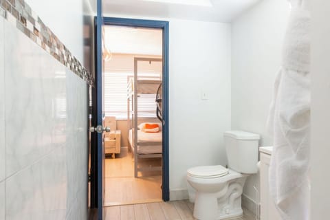One Bedroom Double Queen Suite | Bathroom | Shower, free toiletries, hair dryer, towels