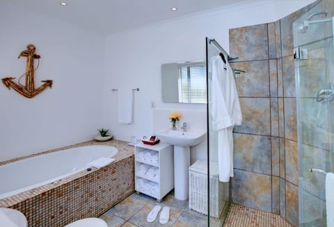 Separate tub and shower, deep soaking tub, designer toiletries